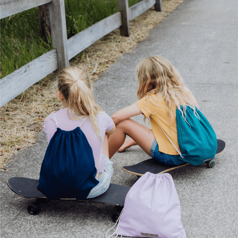 Drawstring school backpacks outdoors