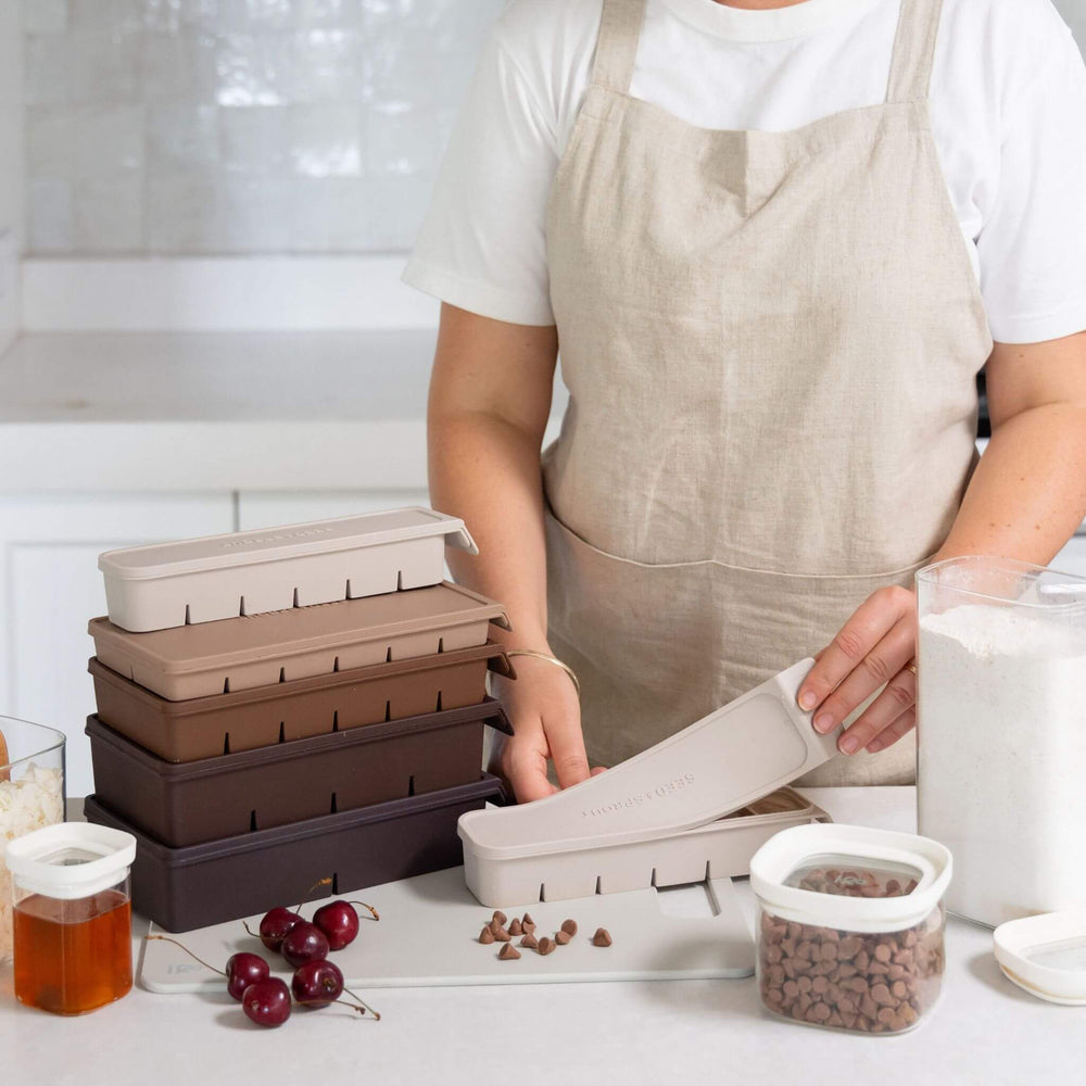 Packing frozen meal portions into a Seed & Sprout freezer tray